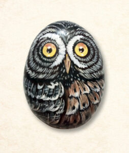Artistic eagle paperweight called Hootie, painted by hand on a natural stone with realistic textures and bold colors