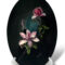 A black-themed magnolia flower painting representing elegance and inner strength on a stand